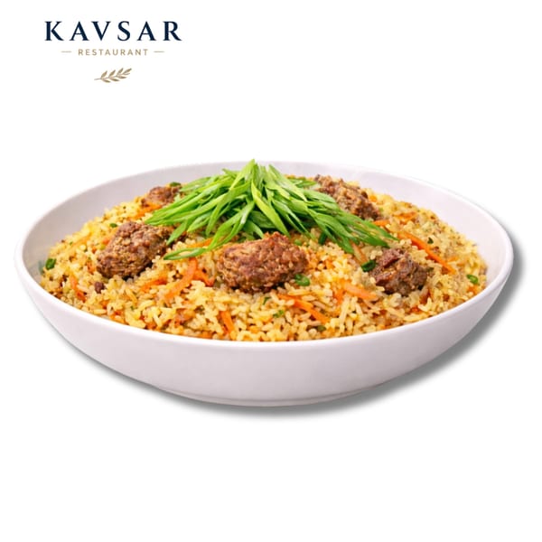 Kavsar Restaurant's plov with meat and green onions in a white bowl.